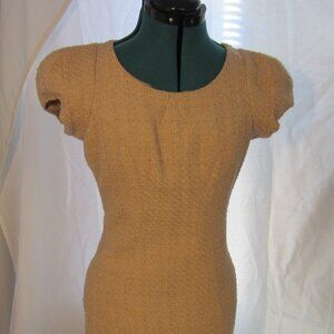 Vintage cream body con dress with metal disc design details. Size small.